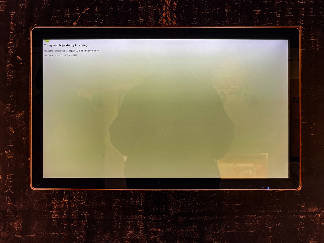 A computer screen shows a hazy green display.
