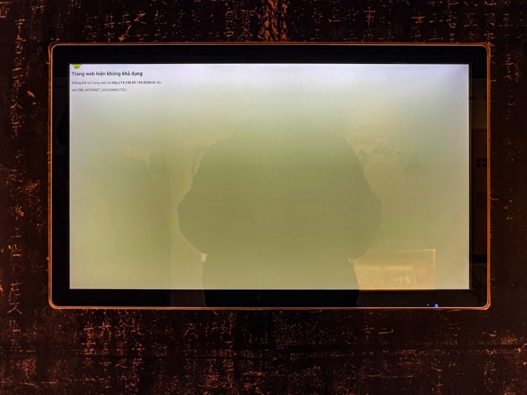 A computer screen shows a hazy green display.