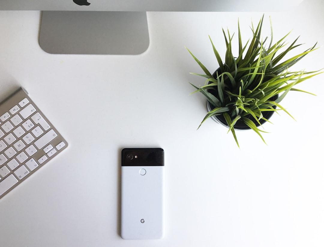 black iphone 5 on white table